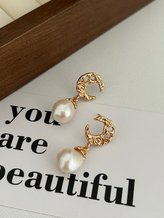 Gold-tone baroque hoop earrings with large white pearl drops
