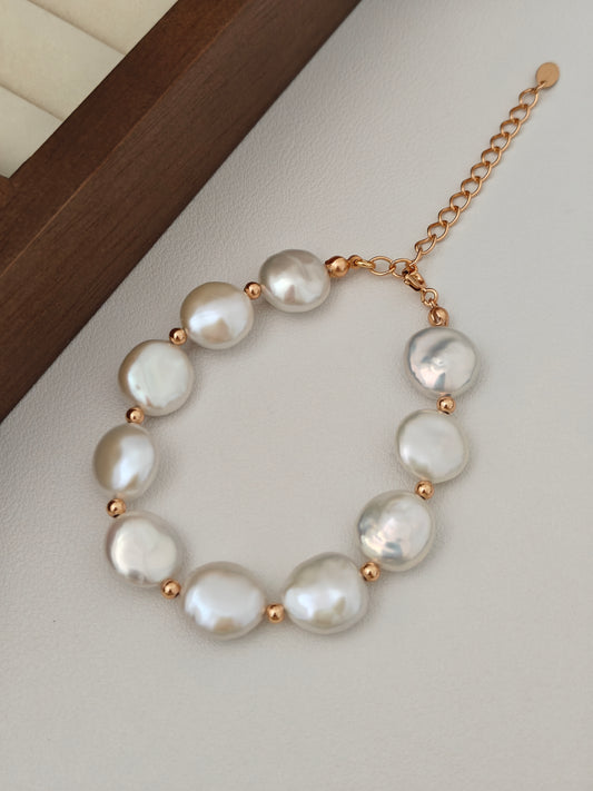 Gold-tone pearl button bracelet with white baroque pearls and open-link chain