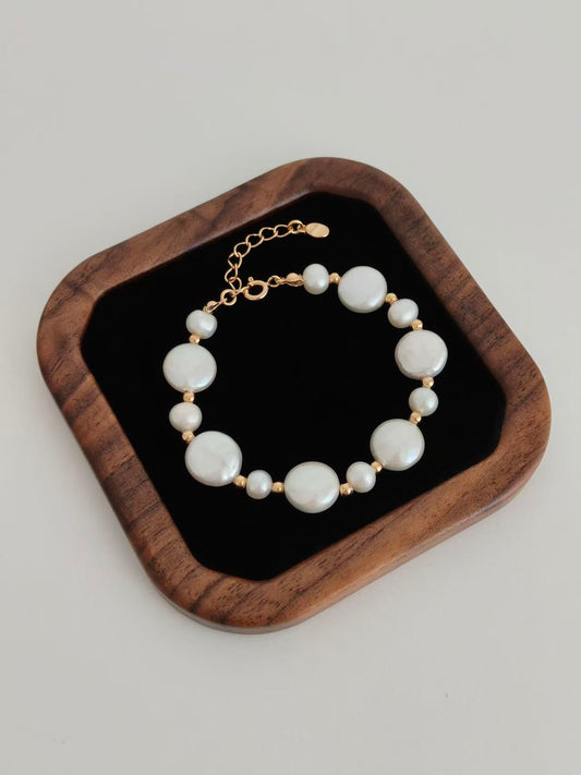 Pearl button bracelet with gold-tone chain and white round pearls