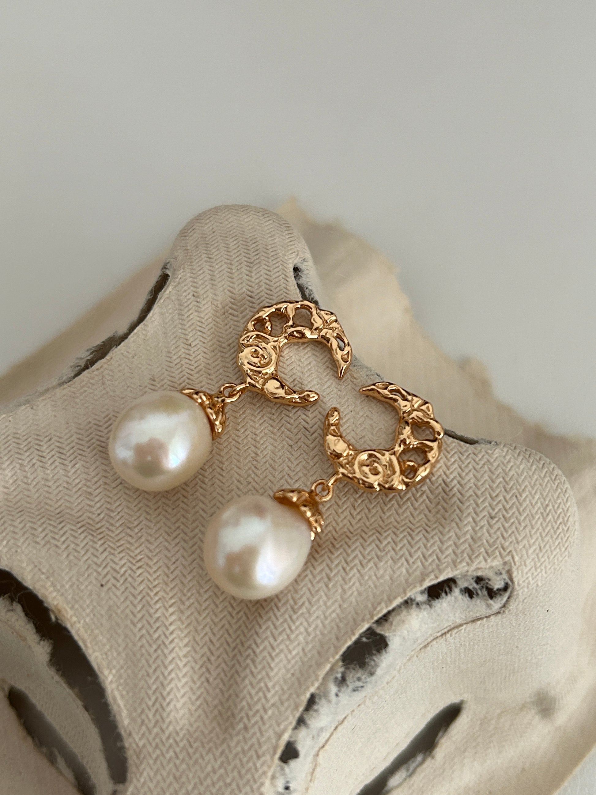 Gold-tone baroque hoop earrings with dangling white pearl drops
